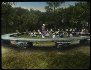 Columbia Park, Chicago (people sitting around and inside a large horseshoe shaped bench)