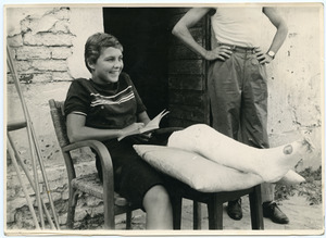 Pat Spaulding seated, in a full-length leg cast