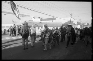 Buddhist monks leading protesters marching in front of the Electric Boat plant to oppose the launch of the Trident II submarine, Tennessee