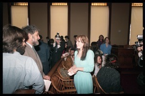 Scene inside the courtroom following acquittal in the CIA protest trial: Abbie Hoffman talks to Amy Carter