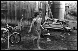 Cathy Rogers running barefoot past the barn, Montague Farm Commune