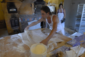 Hungry Ghost Bread: owner and baker Jonathan C. Stevens working on cinnamon rolls