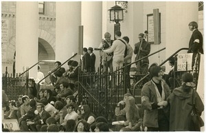 Anti-Vietnam War protesters from Work For Peace on the steps of the First Congregational Church, a folk band playing at the top