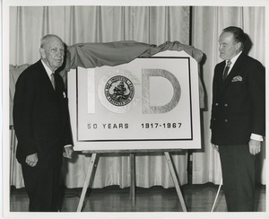 Bob Hope and Jeremiah Milbank, Sr. on stage with ICD logo