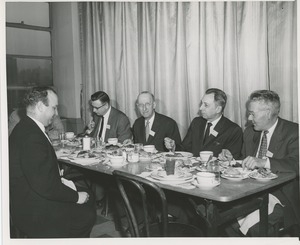 Attendees sitting down to a meal at a joint meeting of the American society of tool engineers and ICD
