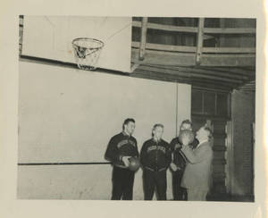 Dr. James Naismith shooting a basket
