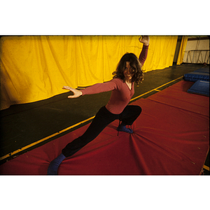 Young woman demonstrating a lunge