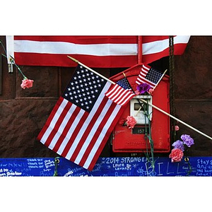American flags at Boylston Street firehouse memorial