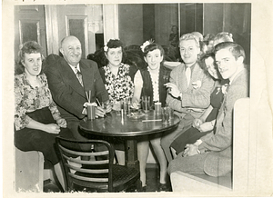 Manny Dias with group at table