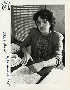 Maria Cunha at desk