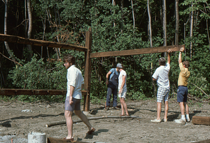 Start of west barn wall erection at the Moon Barn Raising at entrance to Hopkins Forest on 2 August 1975.