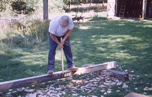 Hopkins Forest Fall Festival, 1999. 5. Richard Babcock shapes a beam.