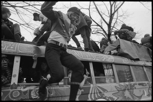 Rider jumping off the roof of the psychedelic bus 'The Road Trip' during the Counter-inaugural demonstrations, 1969