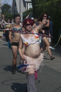 Parade marchers wielding hula hoops : Provincetown Carnival parade