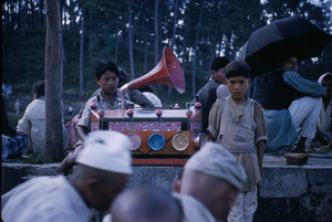 Boys playing a decorated phonograph