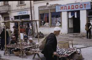 Examining sandals at Skopje market
