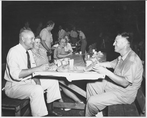 Ralph A. Van Meter seated outdoors at summer barbecue