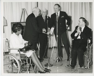 Bob Hope on stage with staff and clients at Institute Day