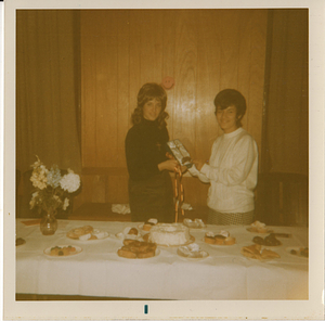 Maria de Lourdes Serpa (right) standing with woman