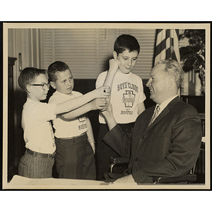 Mayor of Boston John F. Collins poses with three boys