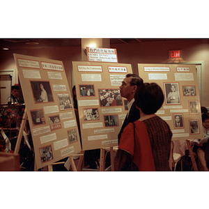 Guests view the Henry Wong memorial display at the Chinese Progressive Association's 15th Anniversary Celebration