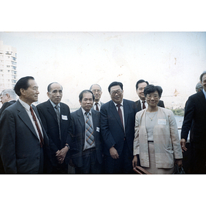 You King Yee, Suzanne Lee, and other members of the Chinese Progressive Association stand with the Vice Governor of Guangdong Province in Boston for a visit