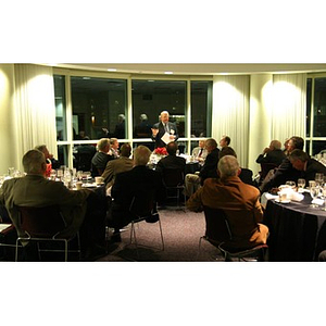 Neal Finnegan speaks to a room full of guests at the Veterans Memorial dinner