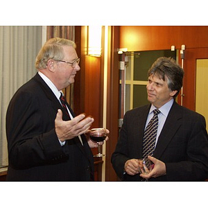 Neal Finnegan (CBA '61), left, and Dean of Northeastern's College of Business Administration Dr. Ira R. Weiss, right, at the College of Business Administration's Distinguished Service Awards ceremony