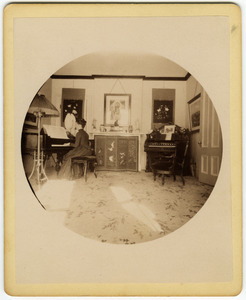 Annie Blanchard playing the piano forte in the parlor