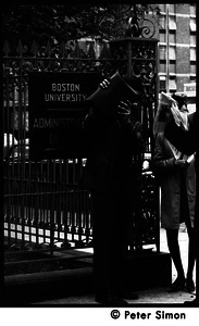 Umoja (Black student union) activists near sign for Boston University Administrative offices, during occupation of administration building (one man blocking the camera with a briefcase)