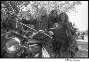 Drapeti, Cathy Brown (Usha), and Leenda seated on a motorcycle at Stinson Beach