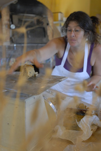 Hungry Ghost Bread: owner and baker Cheryl Maffei weighing cookie dough