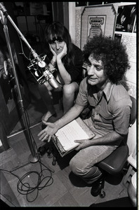 Abbie Hoffman at a microphone at radio station WBCN