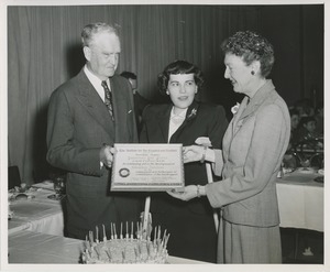 Woman using crutches receives certificate