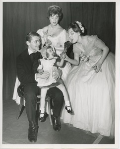 Little girl with turkey leg and performers