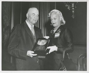 Margaret Milbank Bogert holds the 1956 President's Trophy with awardee Hugo Deffner