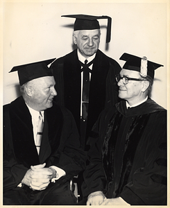 Mayor John F. Collins with two unidentified men, all wearing graduation caps