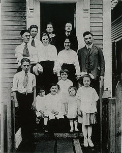 Spinney family on steps of home on Olive St.