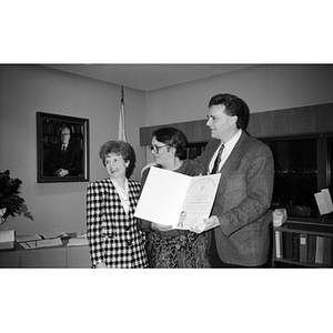 Unidentified people during a certificate presentation ceremony.