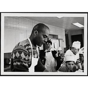 A male staff member and boys from the Tom Pappas Chefs Club in the Boys' Clubs of Boston