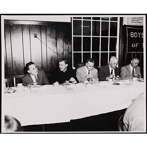 Officers and guests eat and converse at a Boys' Clubs of Boston Awards Night