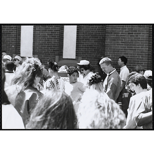 Children and adults waiting around a popcorn stand at the Boys and Girls Clubs of Boston 100th Anniversary Celebration Street Fair