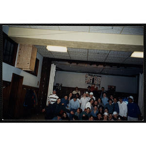 Teenagers pose for a group shot during a New Year's Eve party in the Charlestown Clubhouse