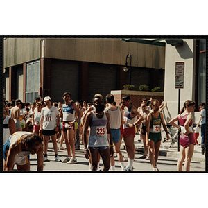 Runners gather at the start line before the beginning of the Battle of Bunker Hill Road Race