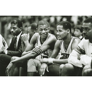 Reggie Lewis and Andre Lafleur relax on the bench during the final minutes of a game