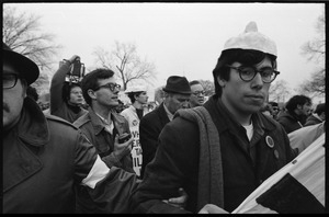 Anti-Vietnam War marchers, one with a Nixon mask on his head, during the Counter-inaugural demonstrations, 1969