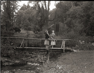 Dorothy Canfield Fisher: Fisher and unidentified woman standing on rustic footbridge