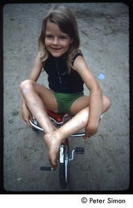 Young girl on a tricycle, Tree Frog Farm commune