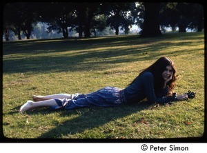 Catherine Blinder, lying on the grass