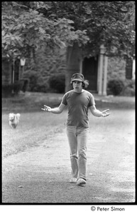 Paul Simon walking down road
